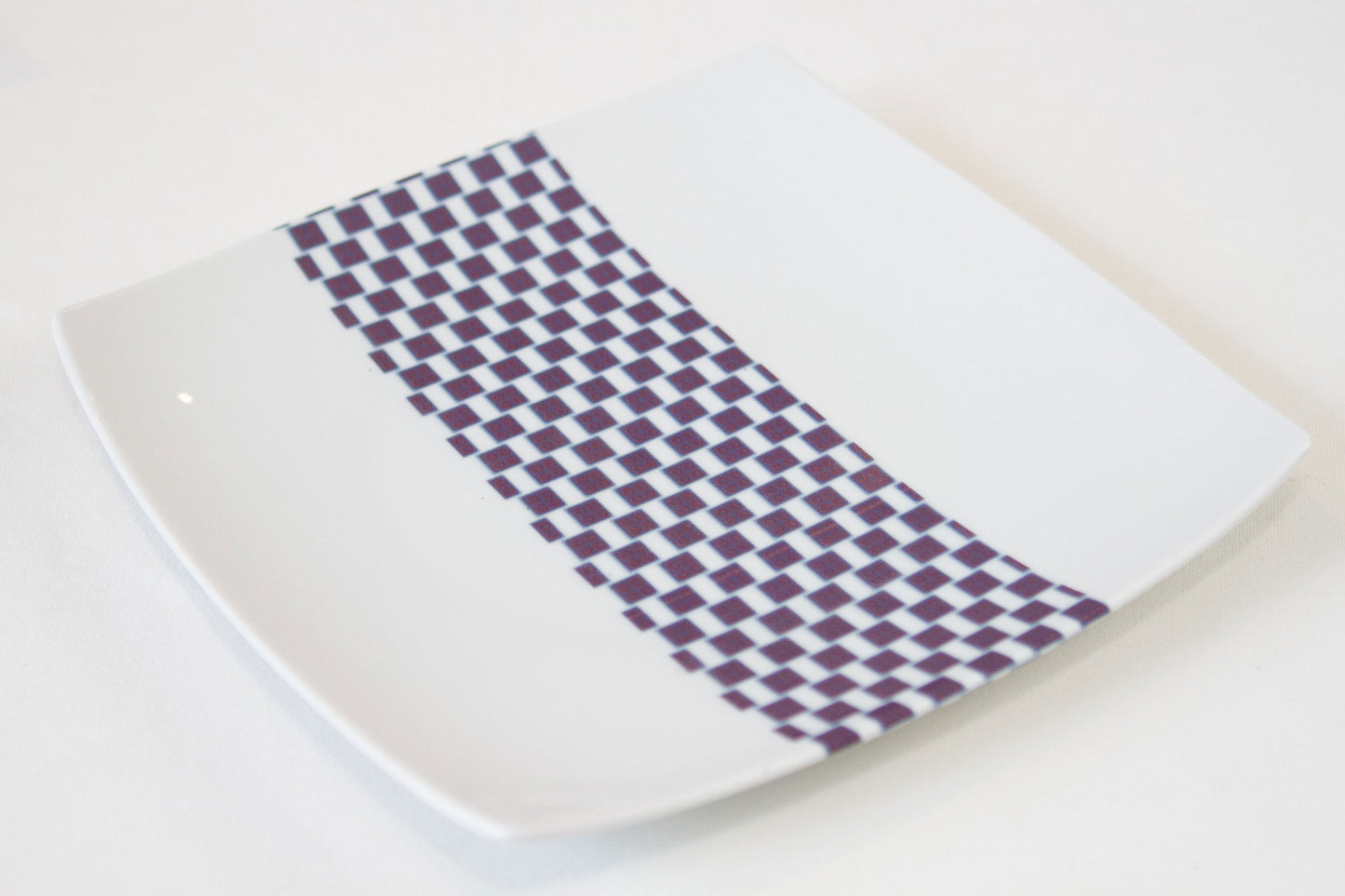 Set of square plates in fine French porcelain made to order with African WAX band motif "Ludo Kouin" in a set of 12